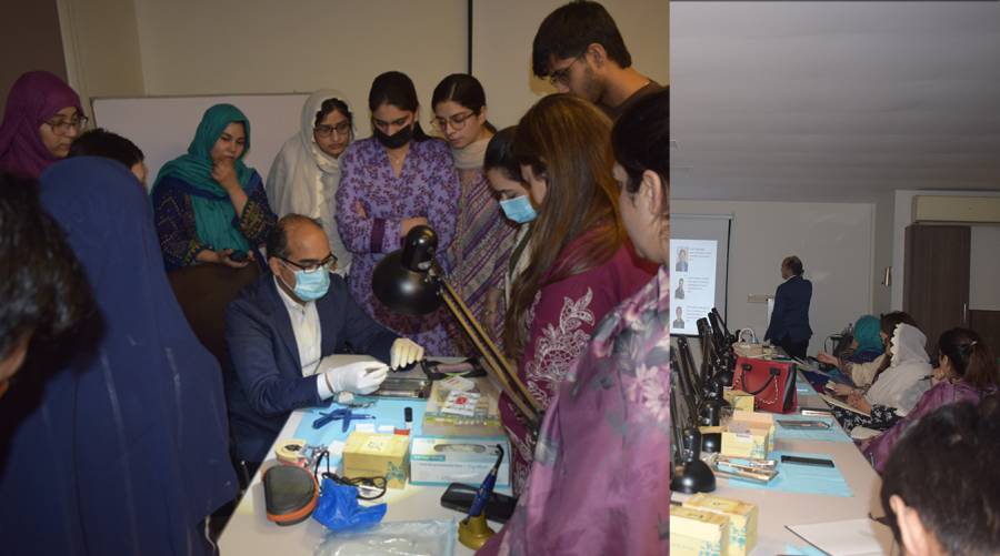 Dr. Salman Ashraf Khan leading a hands-on dental workshop on the restoration of endodontically treated teeth at IADSR, training participants in esthetic restorations and advanced clinical techniques.
