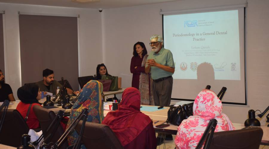 Dental professionals participating in the IADSR hands-on periodontology workshop, where Dr Farheen Qureshi demonstrates diagnostic and surgical techniques essential for periodontal treatment.
