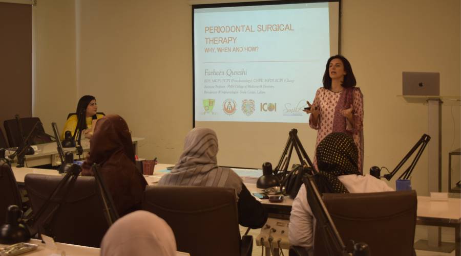 Dental professionals participating in the IADSR hands-on periodontology workshop, where Dr Farheen Qureshi demonstrates diagnostic and surgical techniques essential for periodontal treatment.