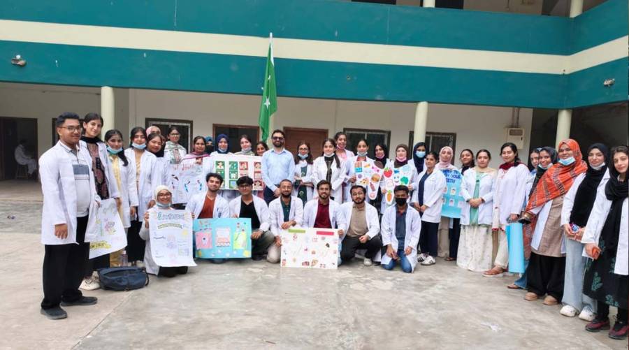 JMDC Community Dentistry team conducting oral health education and dental checkups for students at GBSS Sharfabad Karachi