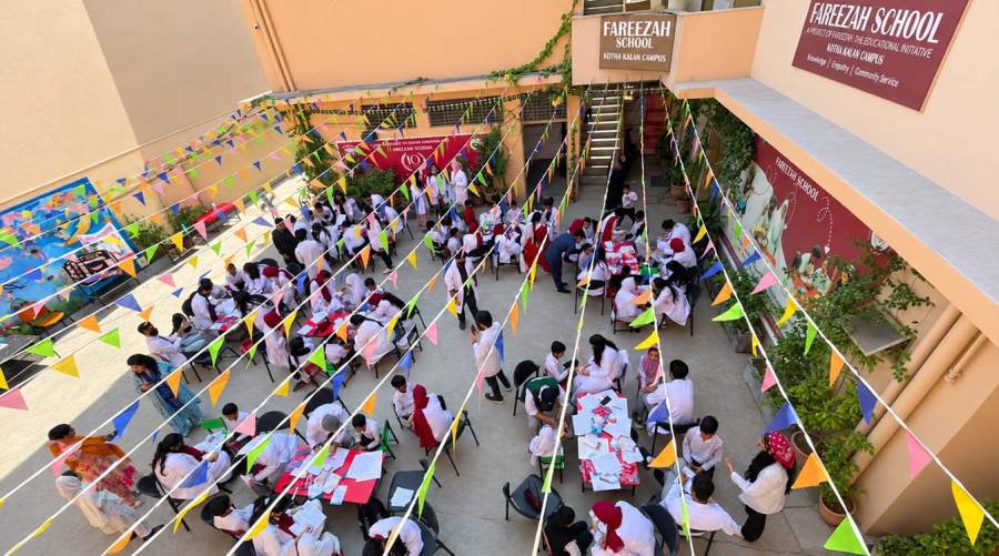 Watim Dental College students and supervising dental staff conduct oral health screening and education for schoolchildren during a community outreach camp.